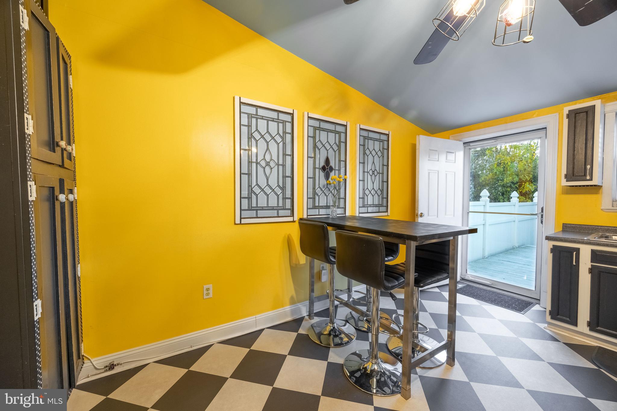 3450 Keswick Road Baltimore, MD 21211 - Photo 17 of 35 a view of a dining room with furniture and chandelier