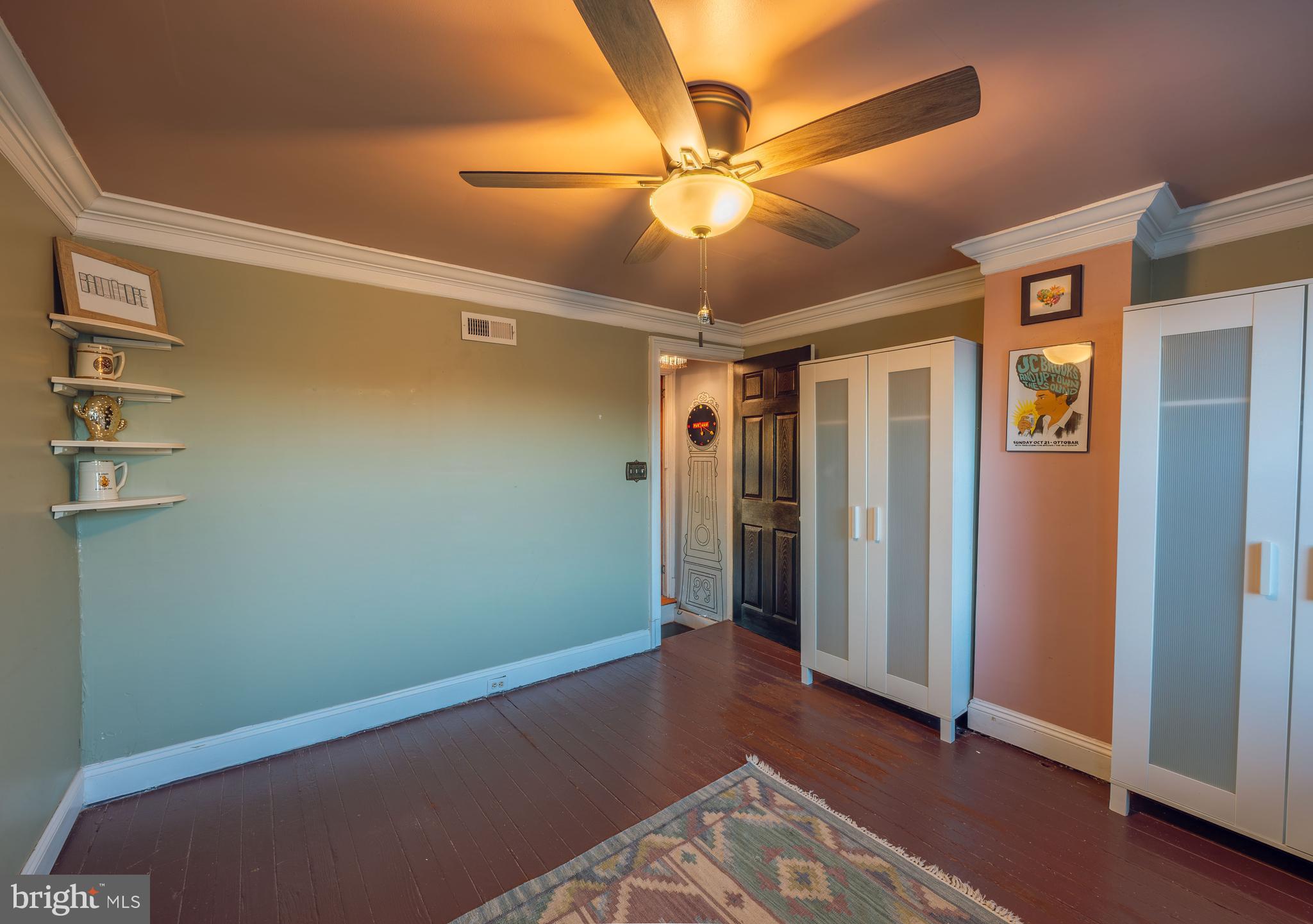 3450 Keswick Road Baltimore, MD 21211 - Photo 18 of 35 a view of room with window and ceiling fan