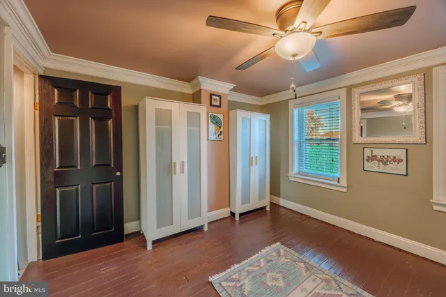 a view of livingroom with hardwood floor and ceiling fan