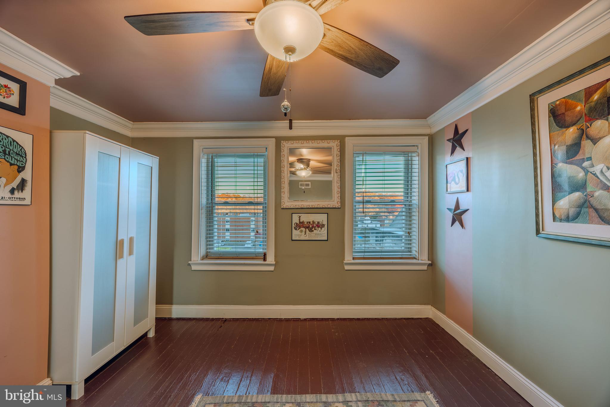 3450 Keswick Road Baltimore, MD 21211 - Photo 20 of 35 a view of an empty room with wooden floor and a window