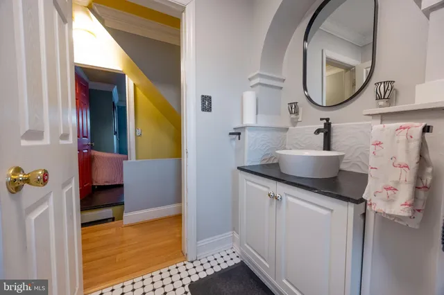 a bathroom with a sink and a mirror