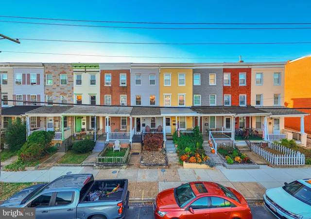 a backyard of a house with outdoor seating