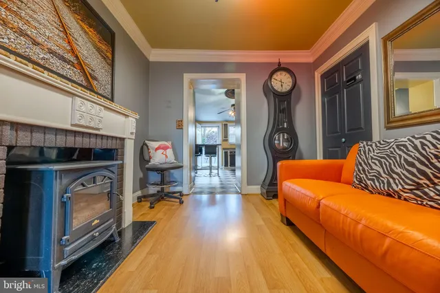 a living room with furniture fireplace and flat screen tv