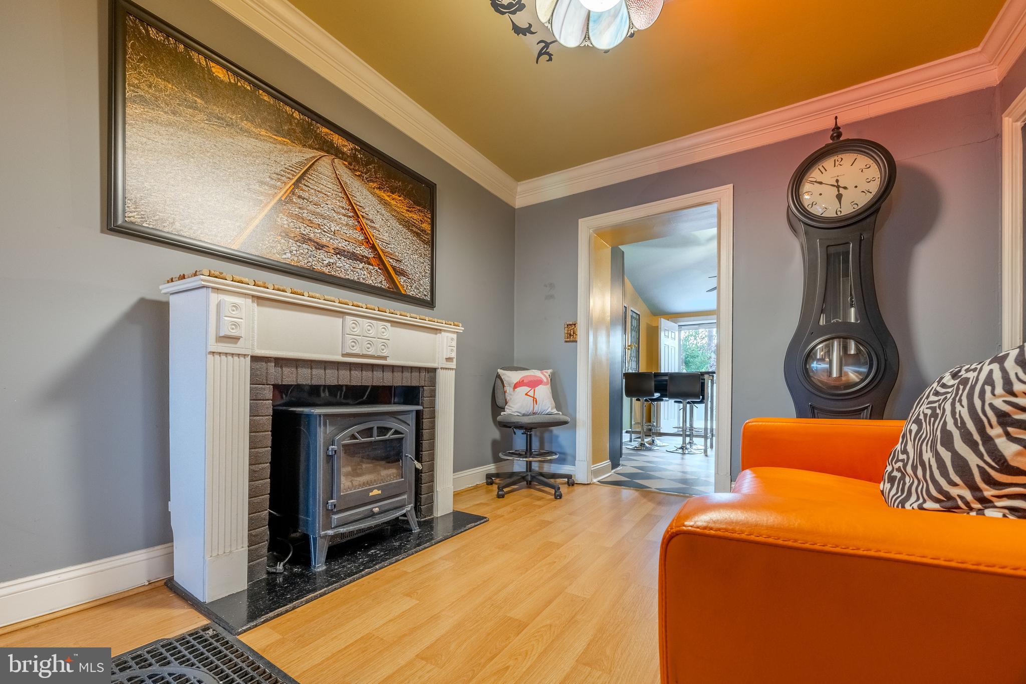 3450 Keswick Road Baltimore, MD 21211 - Photo 7 of 35 a living room with furniture and a fireplace
