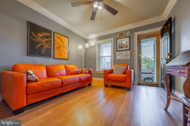 a bedroom with furniture and a large window