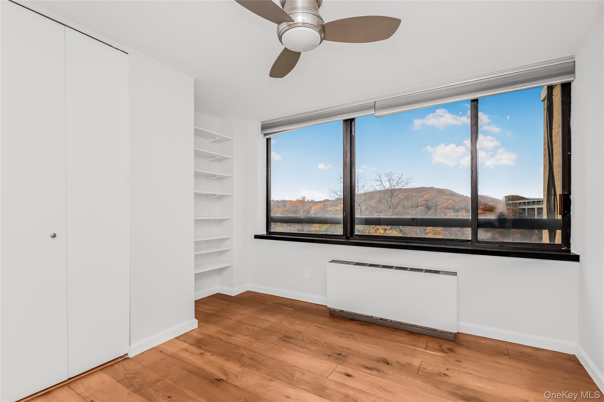 2287 Johnson Avenue, Unit 5F Bronx, NY 10463 - Photo 16 of 22 a view of a room with window and ceiling fan