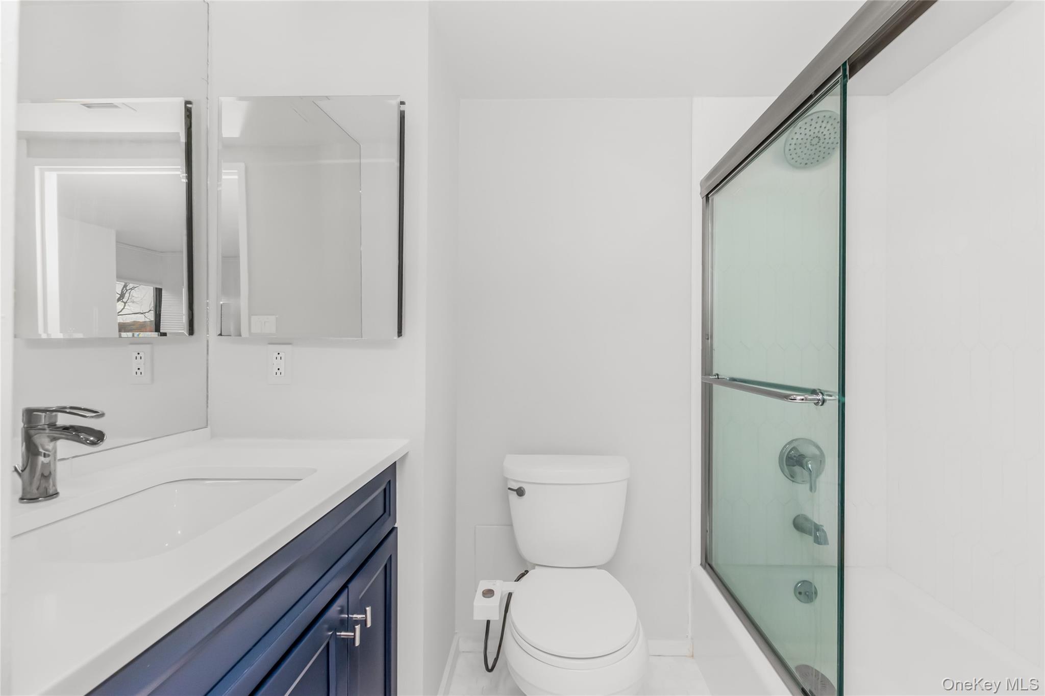 2287 Johnson Avenue, Unit 5F Bronx, NY 10463 - Photo 17 of 22 a bathroom with a sink a toilet and shower