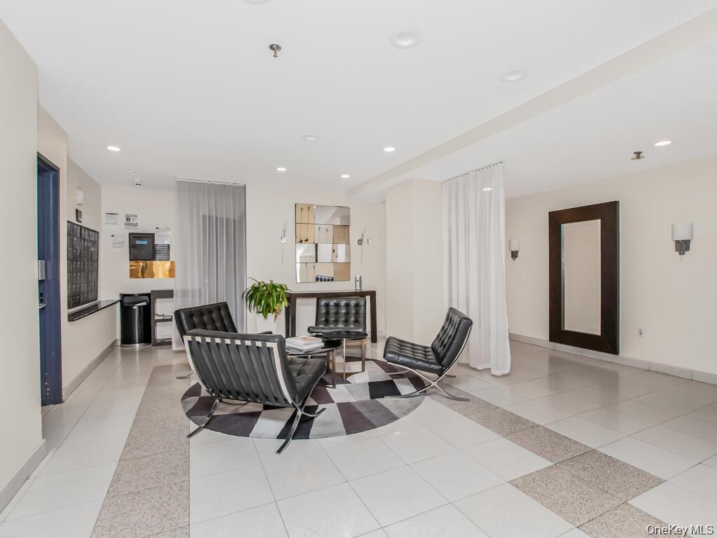 2287 Johnson Avenue, Unit 5F Bronx, NY 10463 - Photo 20 of 22 a living room with furniture a dining table and chairs