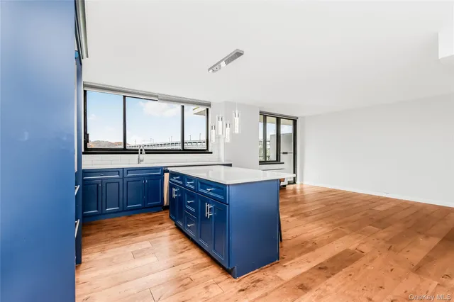 a kitchen with stainless steel appliances granite countertop a stove and a sink