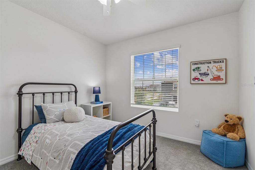 33083 Frosted Clover Way Wesley Chapel, FL 33545 - Photo 11 of 70 a bed room with a bed and a window