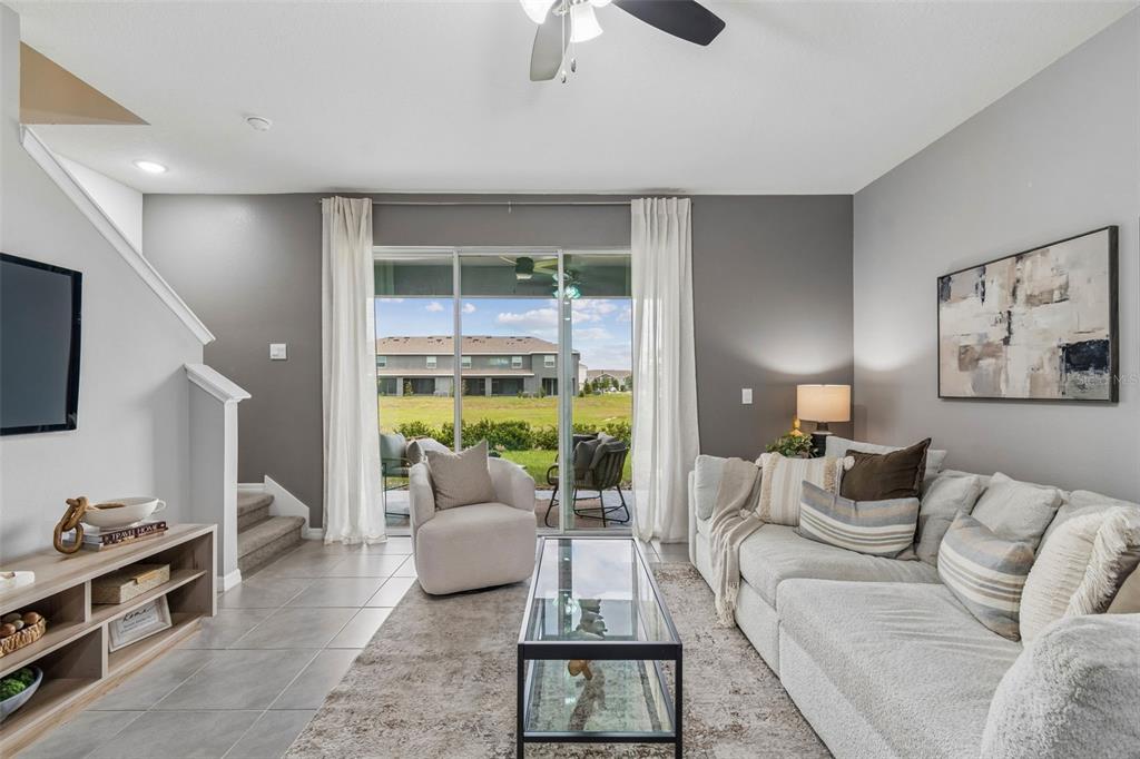 33083 Frosted Clover Way Wesley Chapel, FL 33545 - Photo 15 of 70 a living room with furniture and a flat screen tv