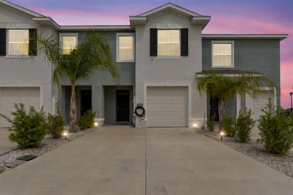 33083 Frosted Clover Way Wesley Chapel, FL 33545 - Photo 19 of 70 a front view of a house with garden