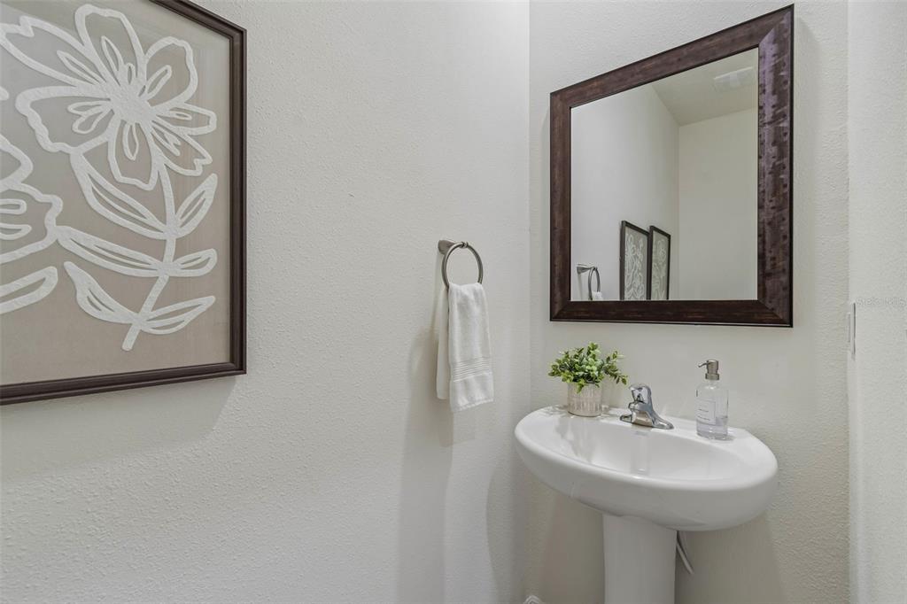 33083 Frosted Clover Way Wesley Chapel, FL 33545 - Photo 24 of 70 a bathroom with a sink and a mirror