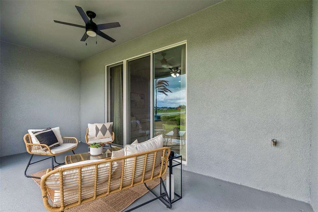 33083 Frosted Clover Way Wesley Chapel, FL 33545 - Photo 51 of 70 a living room with furniture