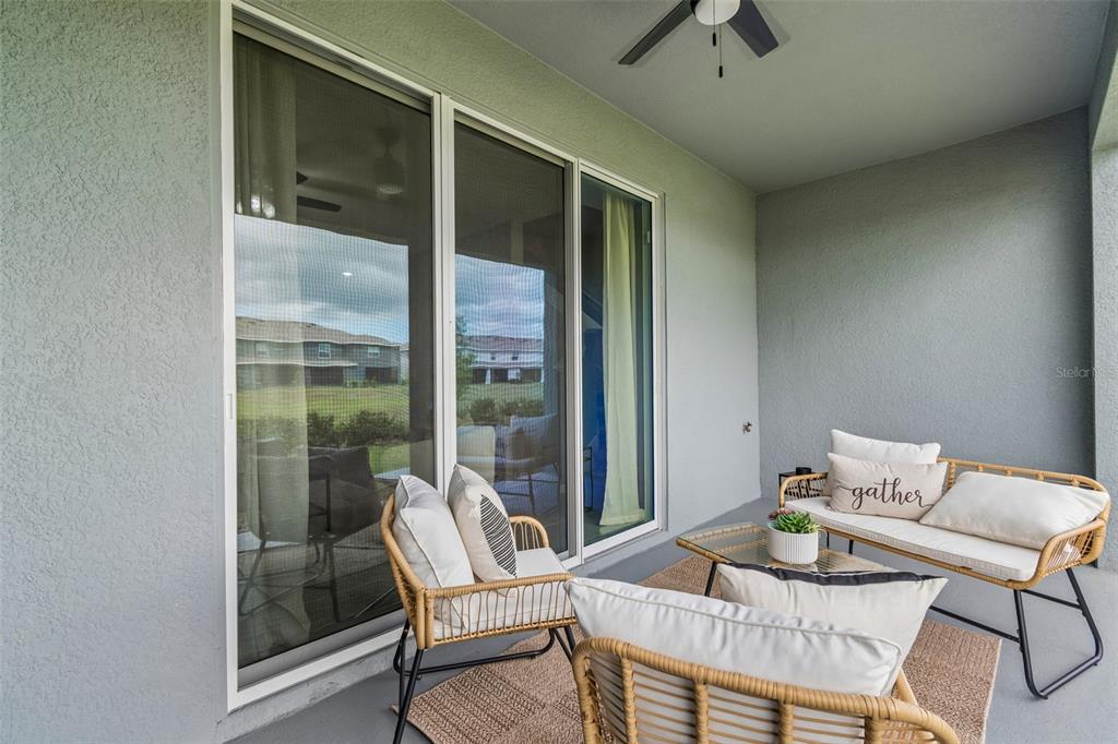 33083 Frosted Clover Way Wesley Chapel, FL 33545 - Photo 52 of 70 a dining room with furniture and a window