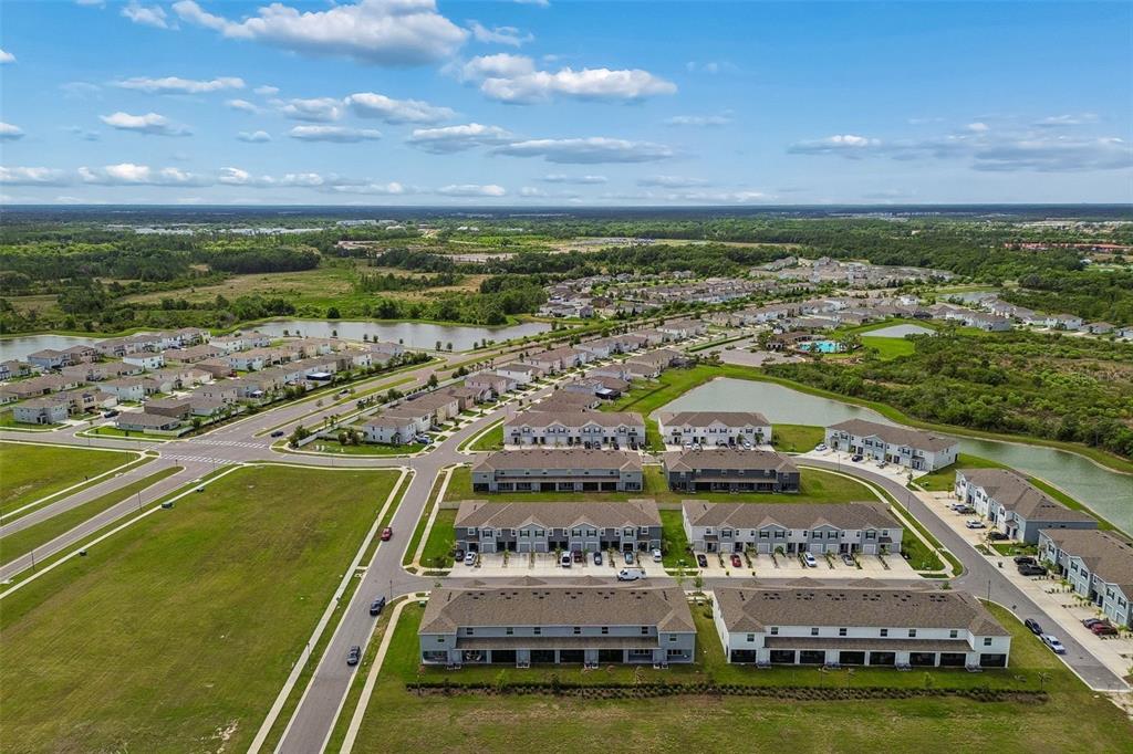 33083 Frosted Clover Way Wesley Chapel, FL 33545 - Photo 56 of 70 a view of a city with a large pool