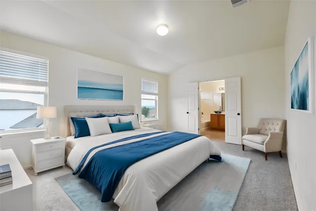 a bedroom with a bed and furniture