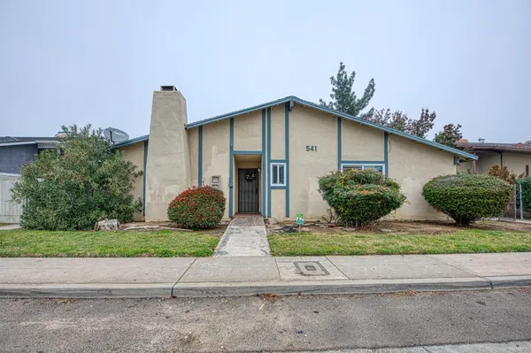 a front view of a house with garage