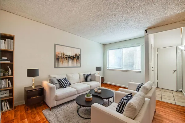 a living room with furniture and a window