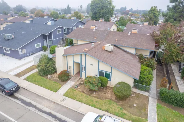 an aerial view of house with yard