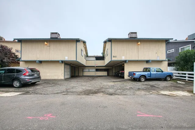 a view of a cars parked in garage