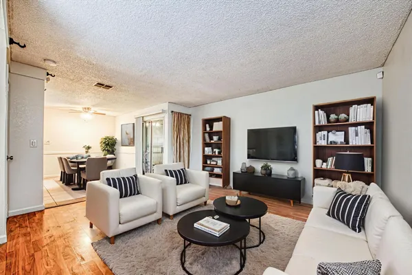 a living room with furniture and a flat screen tv