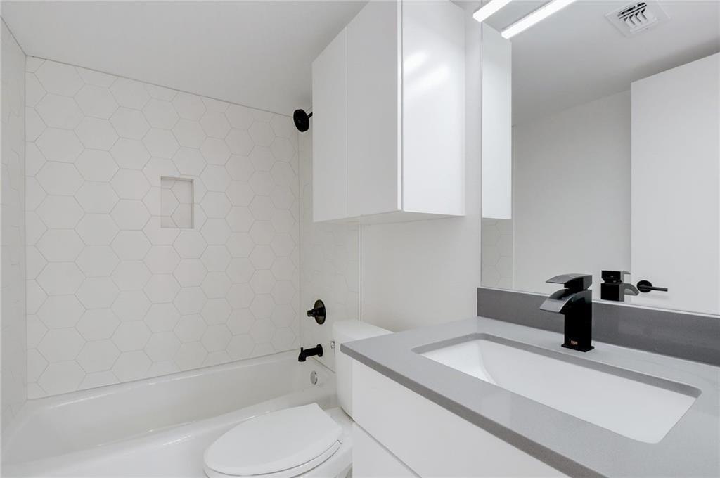 400 East 30th Street, Unit 204 Austin, TX 78705 - Photo 15 of 18 a bathroom with a sink a toilet and shower
