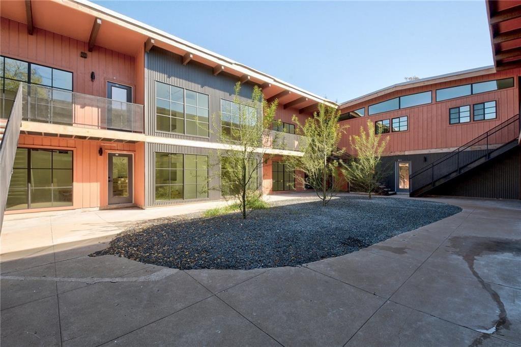 400 East 30th Street, Unit 204 Austin, TX 78705 - Photo 16 of 18 a front view of a building with a yard