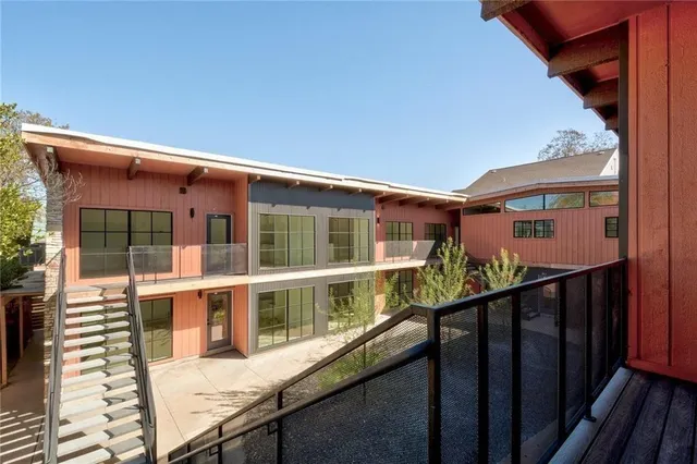 a view of a balcony with a large window