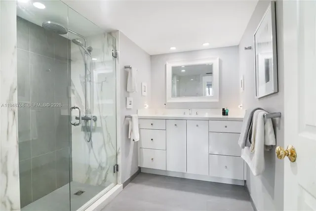 a bathroom with a sink and a shower