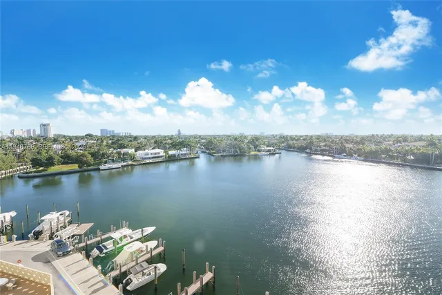 a view of a lake with couches in the patio