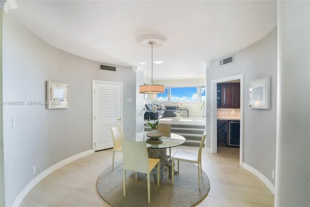 a dining room with furniture and window