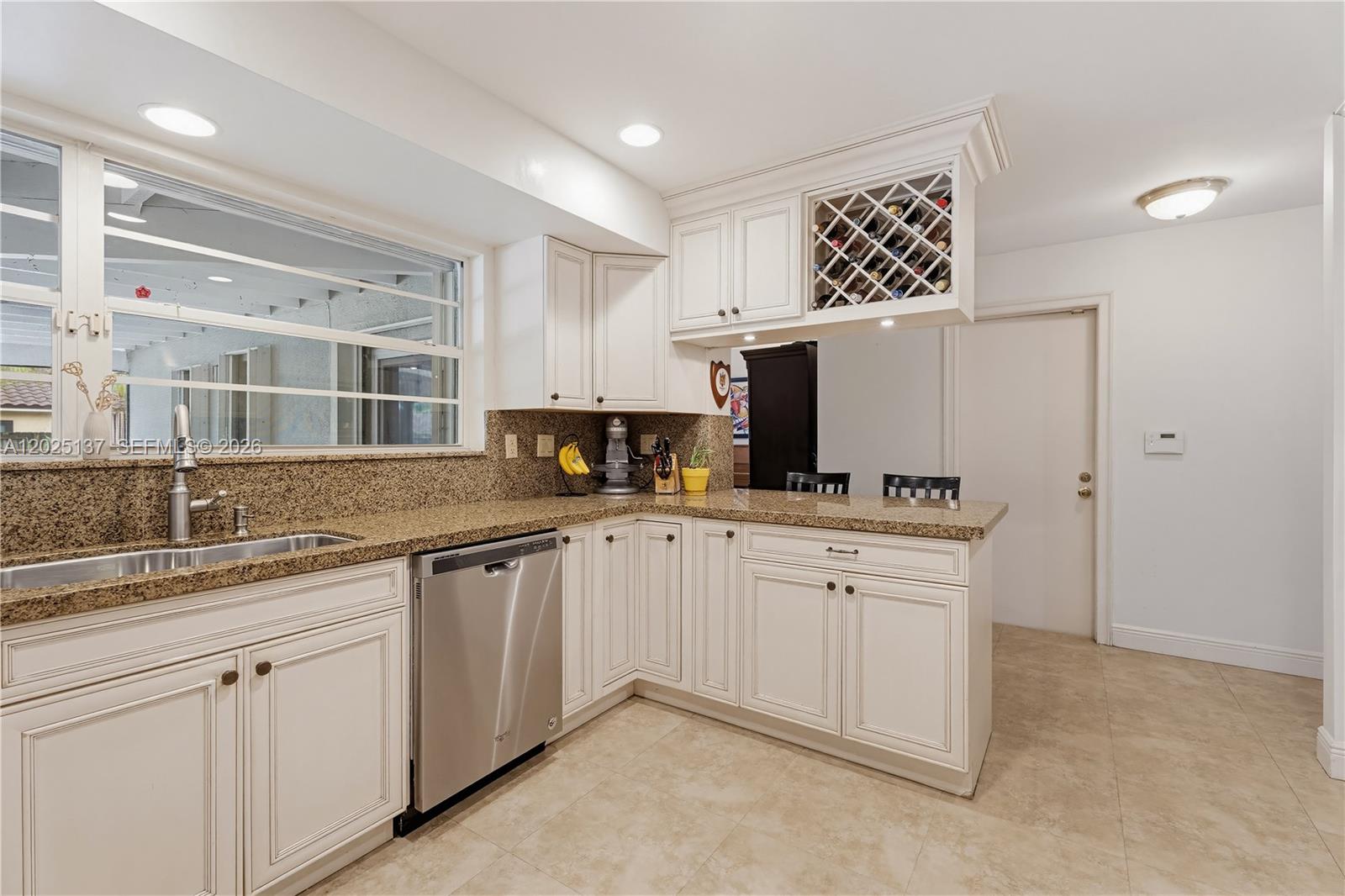 11480 Southwest 96th Terrace Miami, FL 33176 - Photo 14 of 54 a kitchen with granite countertop white cabinets and white appliances