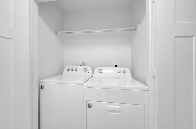 a utility room with dryer and washer