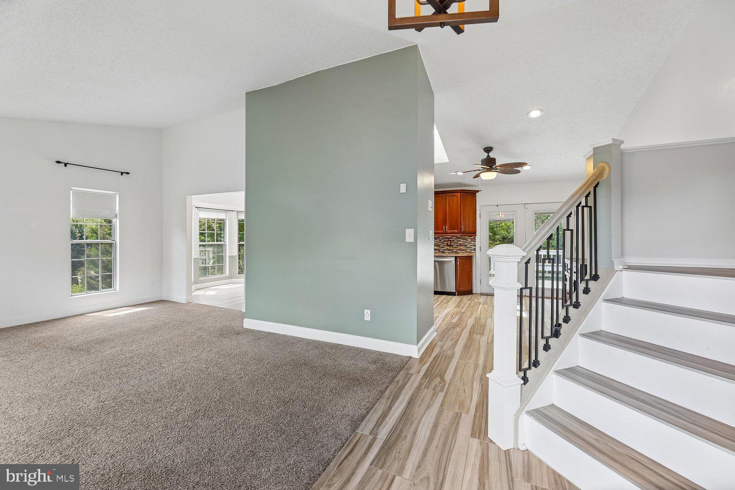 15764 Beau Ridge Drive Woodbridge, VA 22193 - Photo 3 of 58 a view of a livingroom with wooden floor and stairs