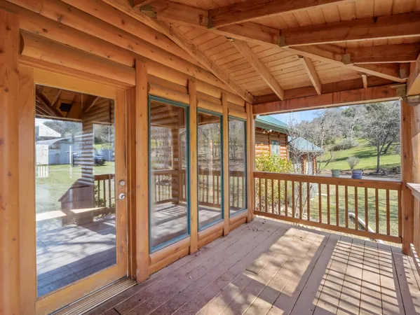 a view of a balcony with wooden floor