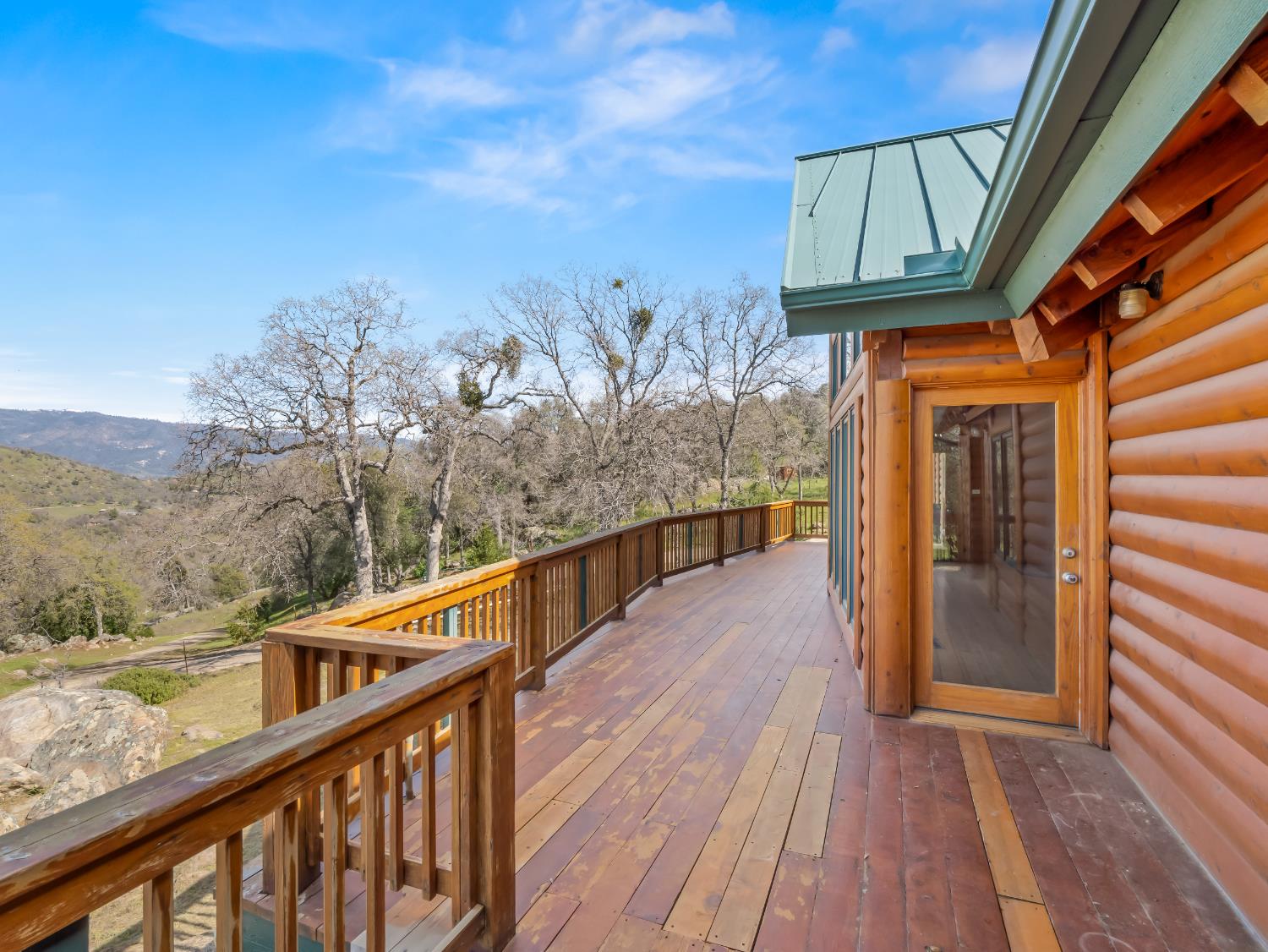 37678 Cardinal Lane Squaw Valley, CA 93675 - Photo 21 of 65 a balcony with wooden floor and stairs