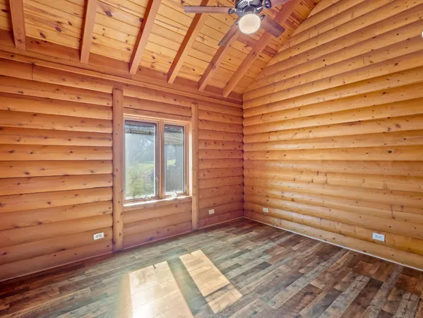 a view of a room with stairs and wooden floor