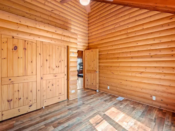a view of a room with wooden walls