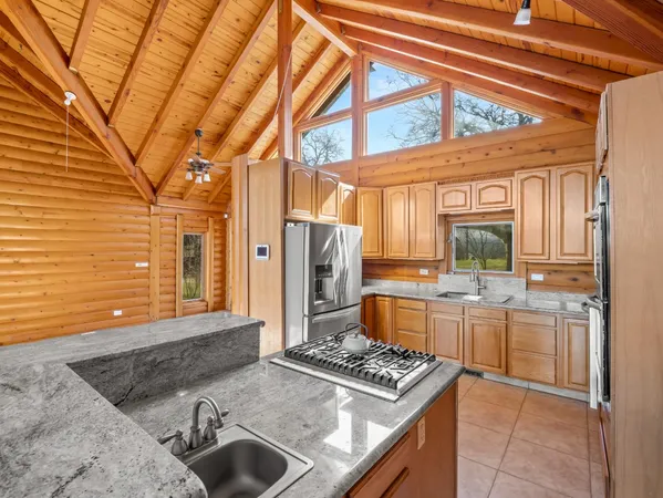 a kitchen with a stove and a refrigerator