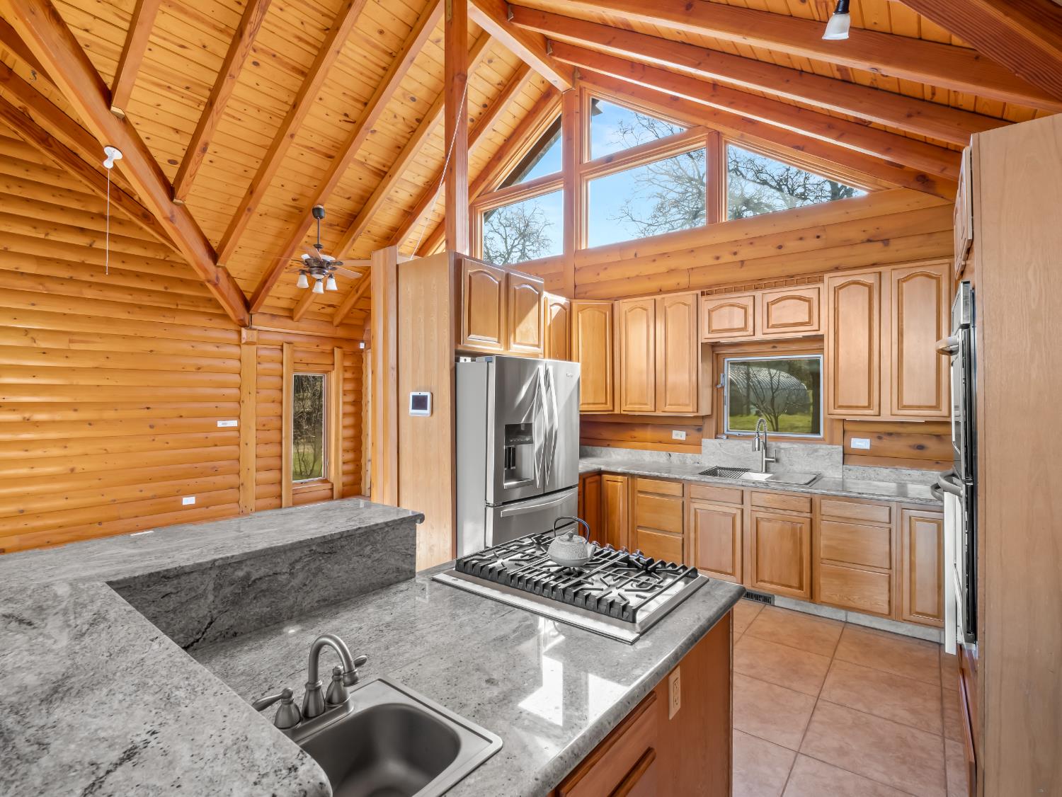 37678 Cardinal Lane Squaw Valley, CA 93675 - Photo 47 of 65 a kitchen with a stove and a refrigerator