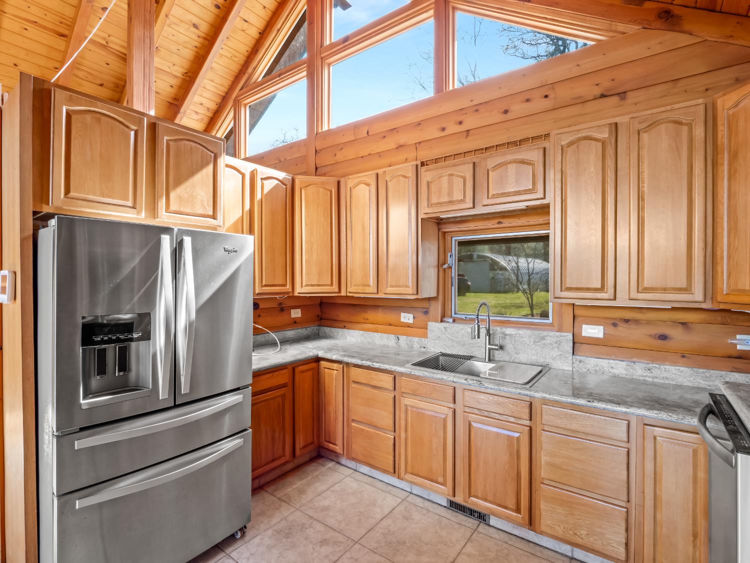 37678 Cardinal Lane Squaw Valley, CA 93675 - Photo 49 of 65 a kitchen with stainless steel appliances granite countertop a sink and cabinets