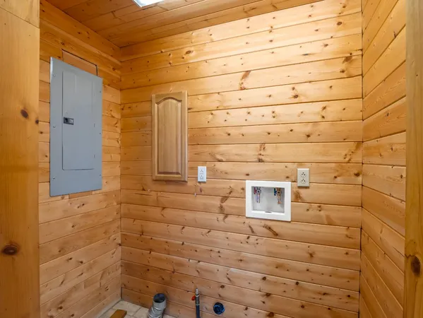a bathroom with a granite countertop sink mirror and a bathtub