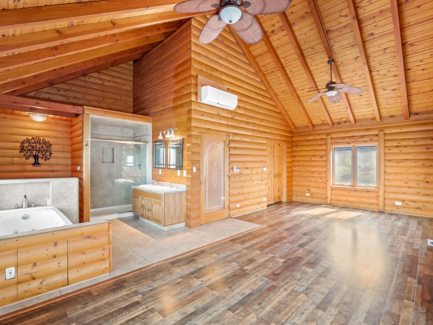 37678 Cardinal Lane Squaw Valley, CA 93675 - Photo 60 of 65 a view of an empty room with wooden floor and a window