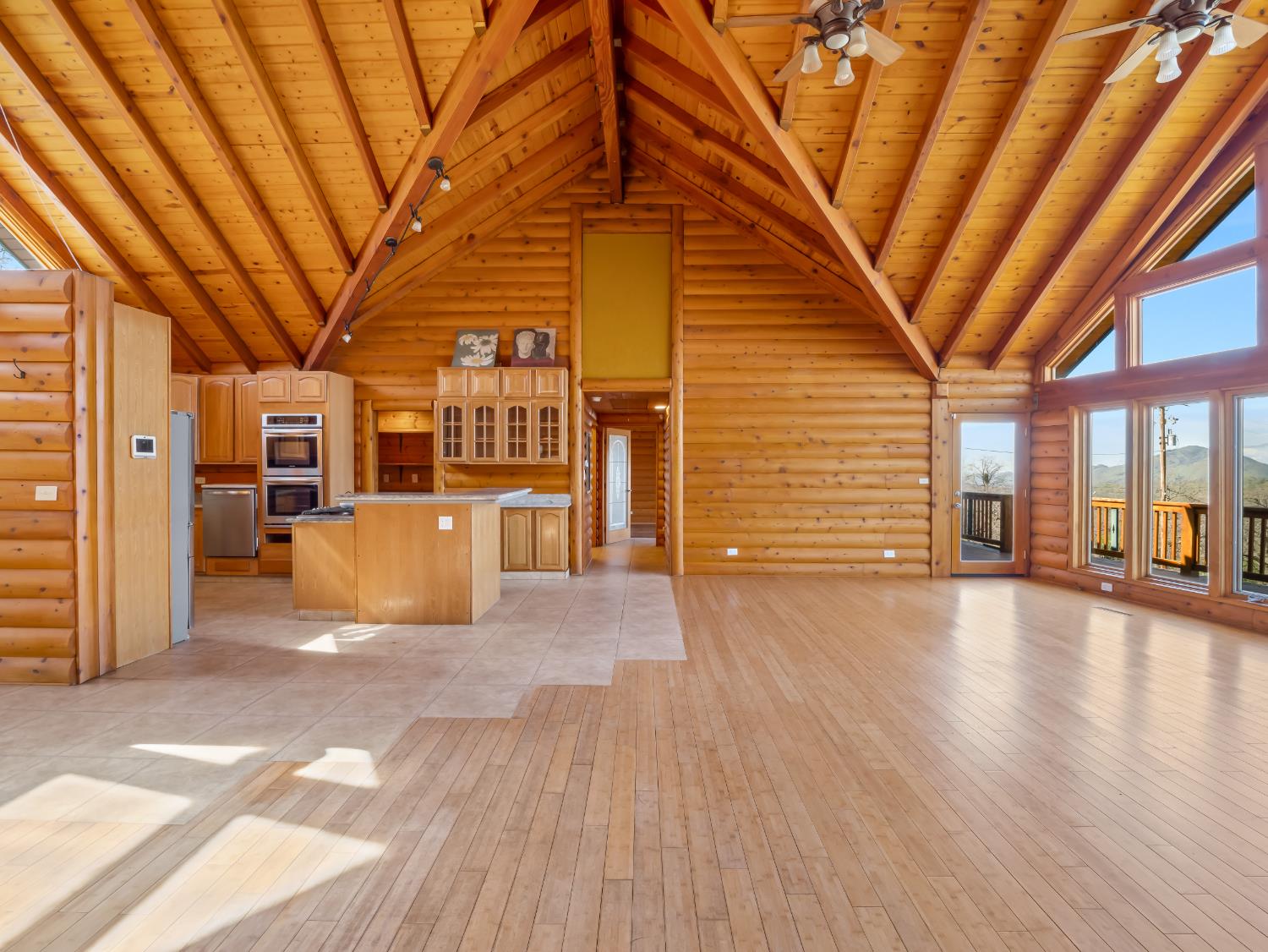 37678 Cardinal Lane Squaw Valley, CA 93675 - Photo 65 of 65 a view of a hall with wooden floor and a yard