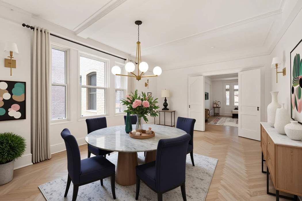 103 East 84th Street, Unit 6B Manhattan, NY 10028 - Photo 3 of 19 a view of a dining room with furniture window and wooden floor