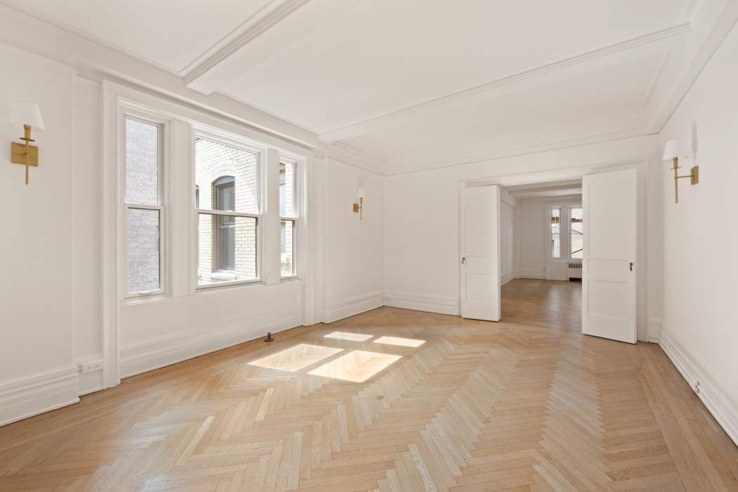 103 East 84th Street, Unit 6B Manhattan, NY 10028 - Photo 4 of 19 a view of an empty room with a window