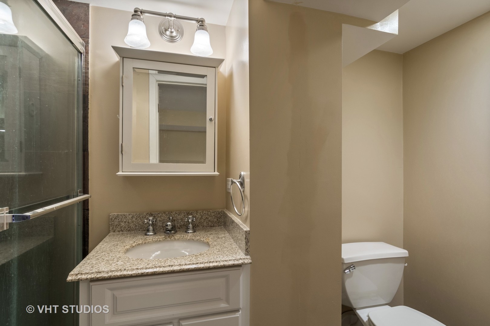 299 Barberry Road Highland Park, IL 60035 - Photo 12 of 17 a bathroom with a granite countertop sink toilet and mirror