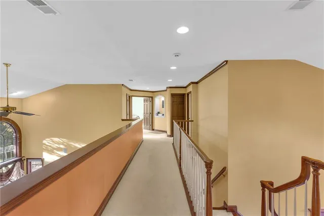 a bedroom with a bed a window and dresser