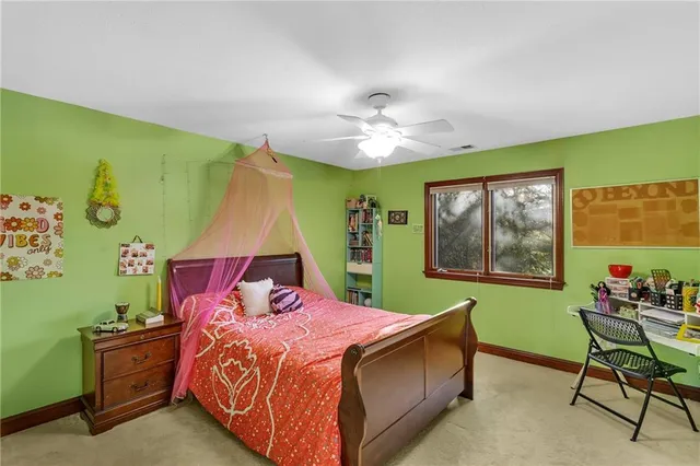 a bed room with a bed and a window